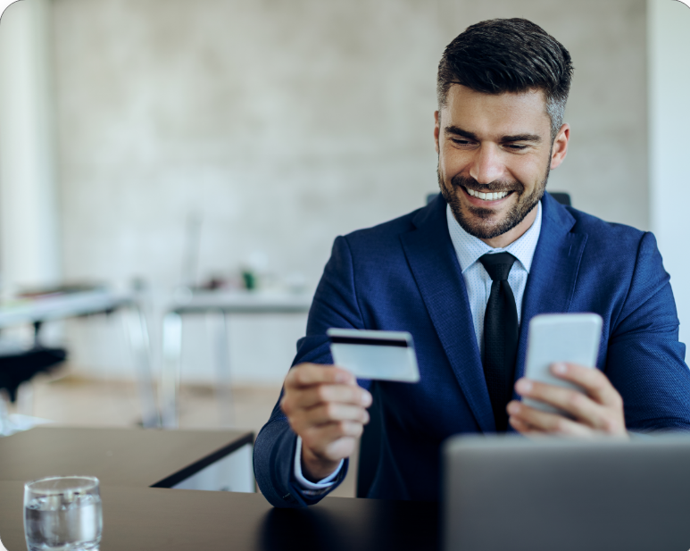 happy-entrepreneur-online-banking-with-credit-card-mobile-phone-office